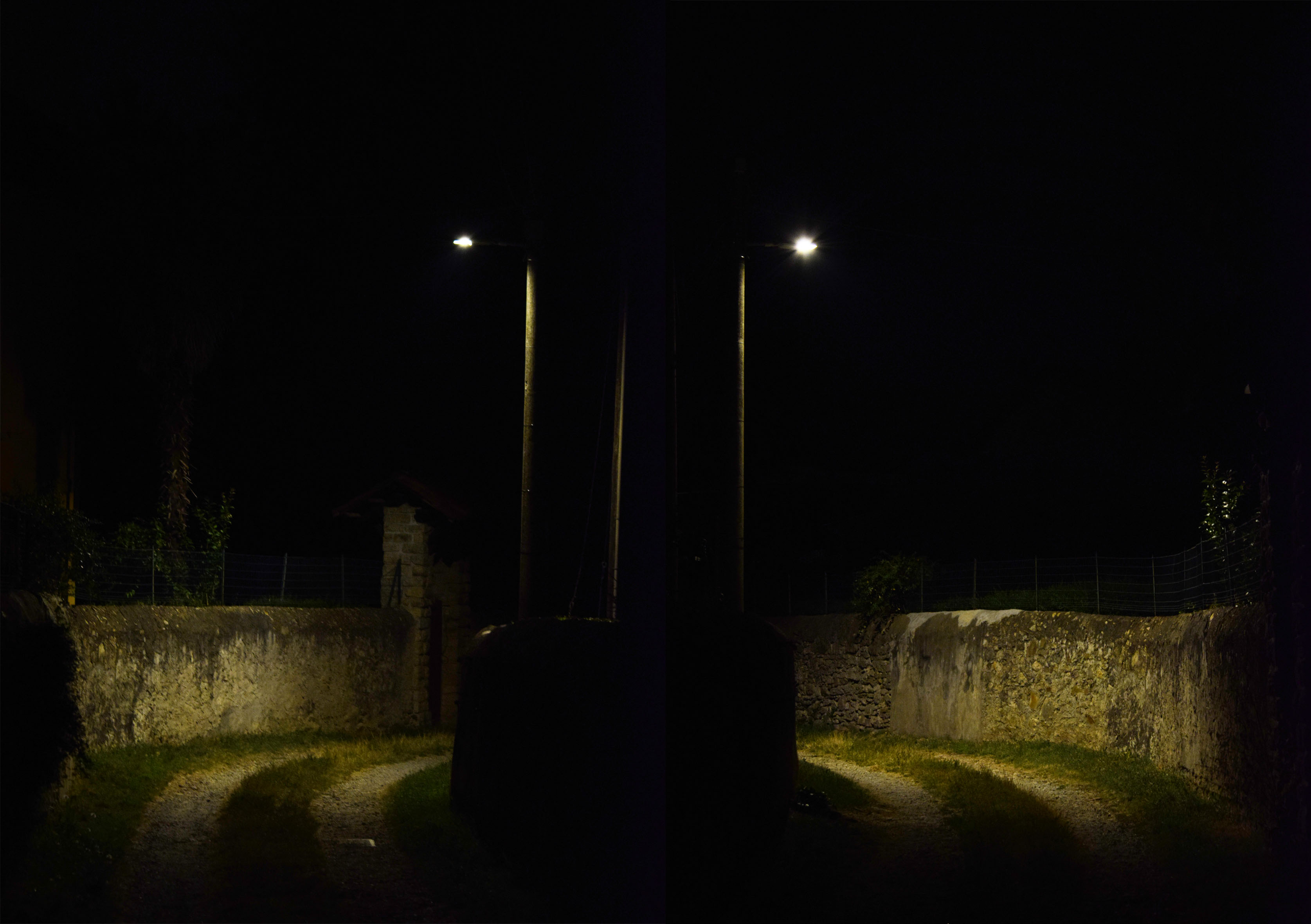 Fotografia di una strada sterrata con due bivi illuminati da una scarsa luce.